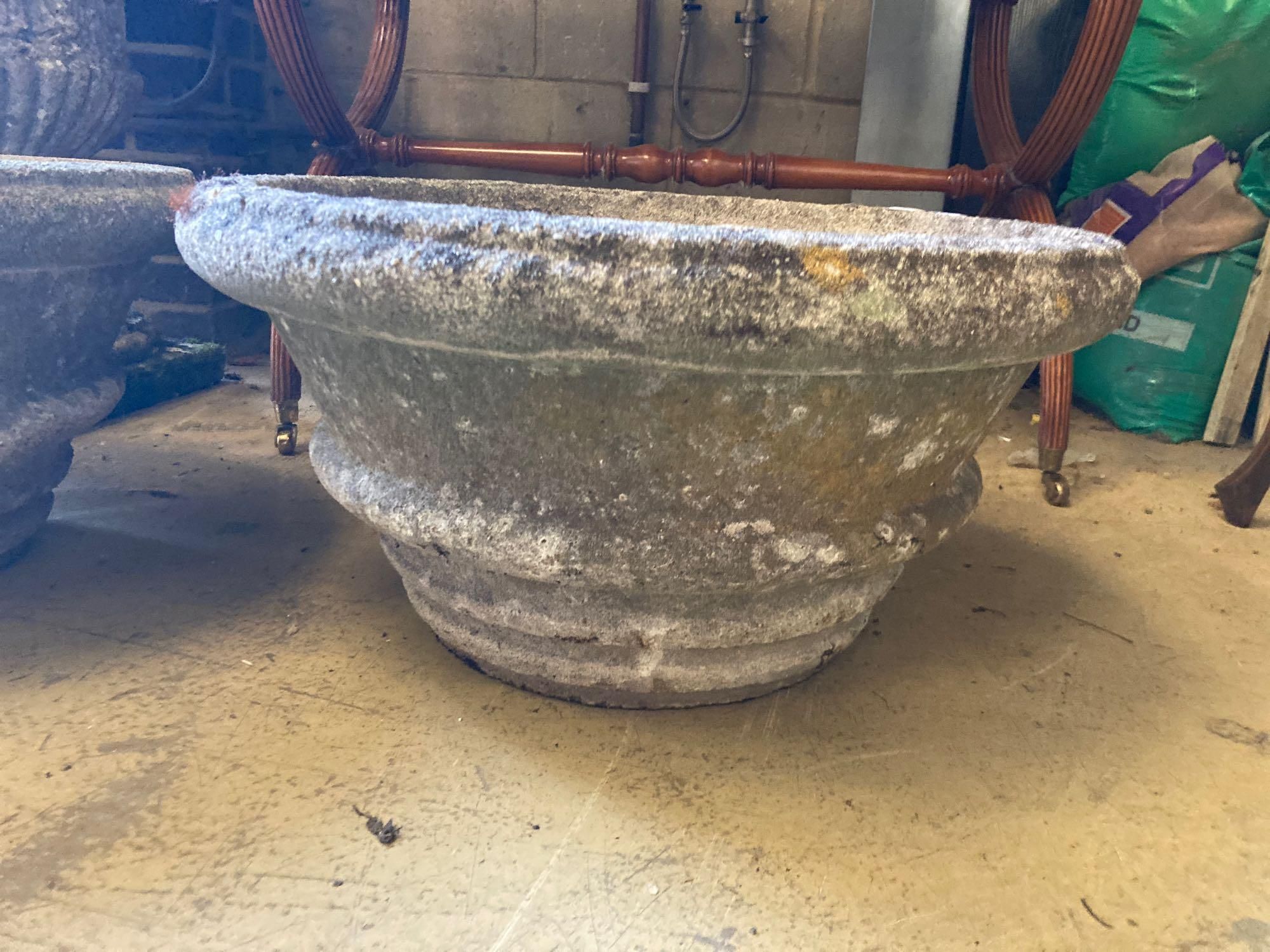 A pair of reconstituted stone garden urns, diameter 60cm height 31cm